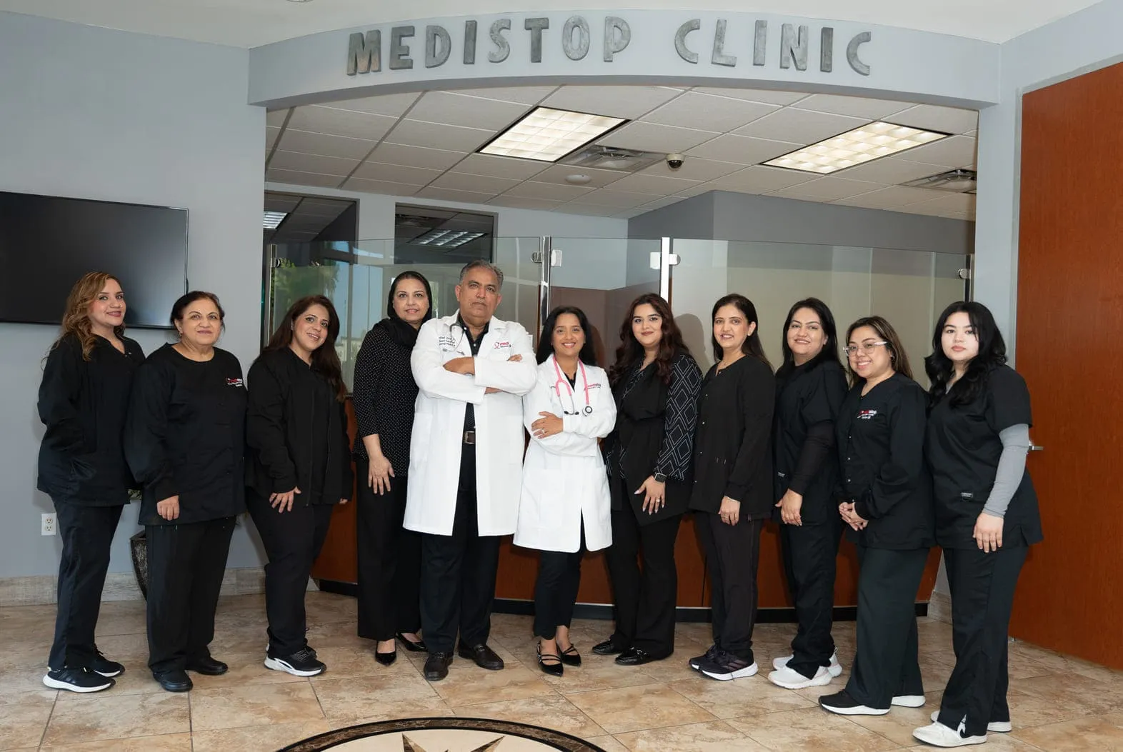Dr. Arshad Umer with the Medistop Primary Care team providing compassionate, patient-focused healthcare.