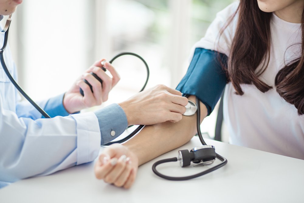 Doctor performing a preventive health examination to support long-term wellness and early disease detection.