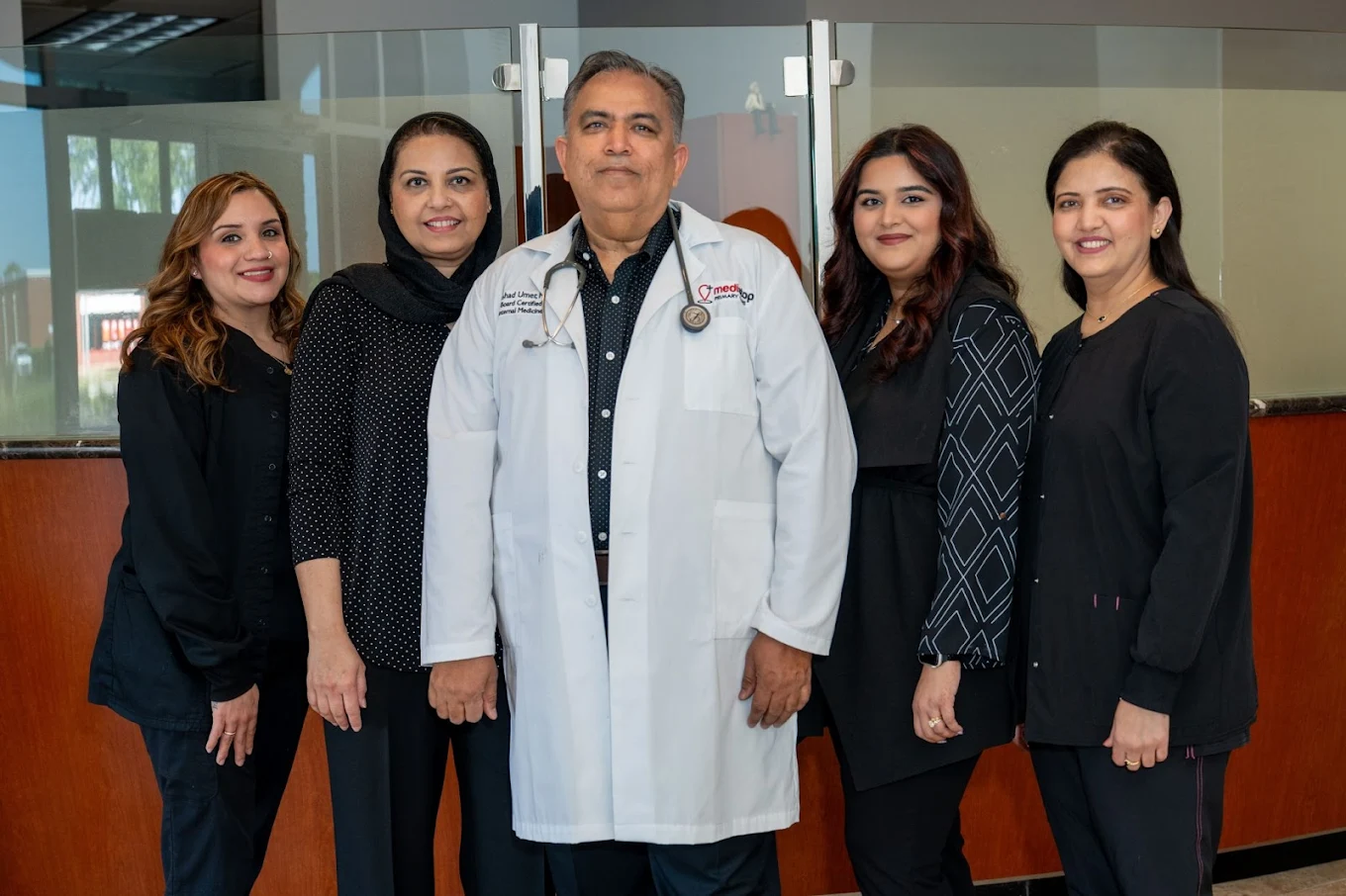 Dr. Arshad Umer with the Medistop Primary Care team providing compassionate, patient-focused healthcare.