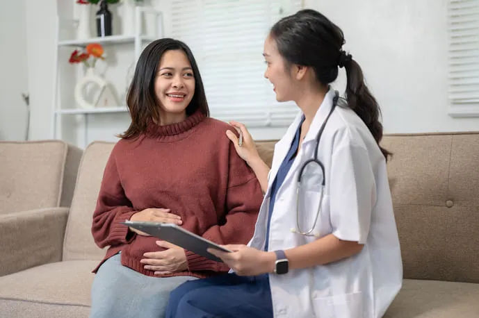 Doctor providing personalized women's healthcare during a routine consultation at Medistop Primary Care.